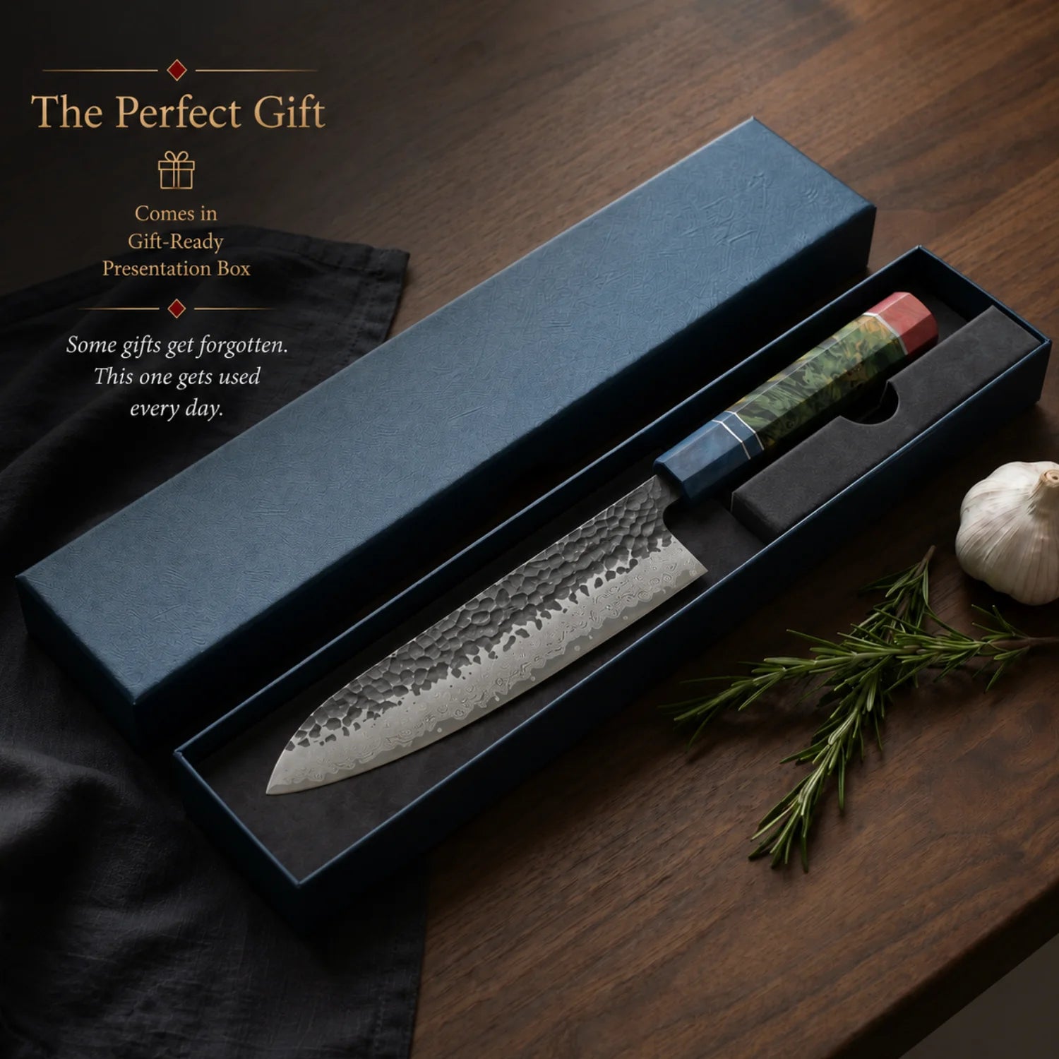 Chef's knife in a gift-ready presentation box on a wooden surface with text about the perfect gift.